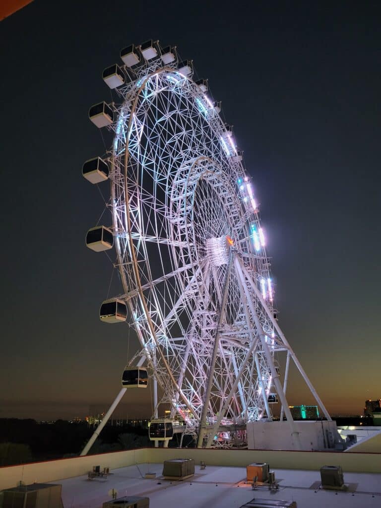 The Wheel at ICON Park illuminated at night in Orlando, Florida