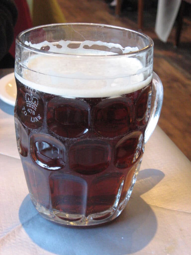 Pint of craft ale with a foam head, similar to what's served at Gatlinburg Brewing Company