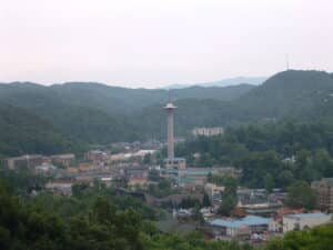 View of downtown Gatlinburg, Tennessee with the Space Needle and surrounding Smoky Mountains