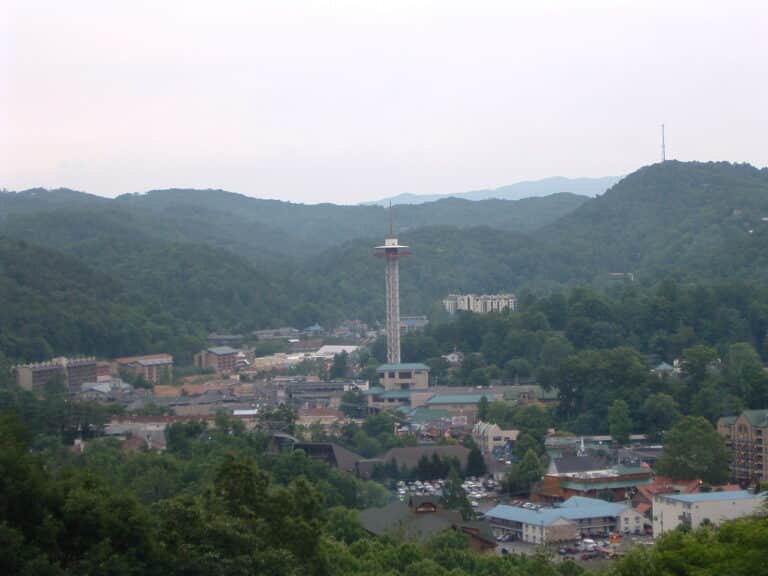 View of downtown Gatlinburg, Tennessee with the Space Needle and surrounding Smoky Mountains